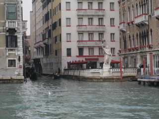 Statue holding torch, Grand Canal